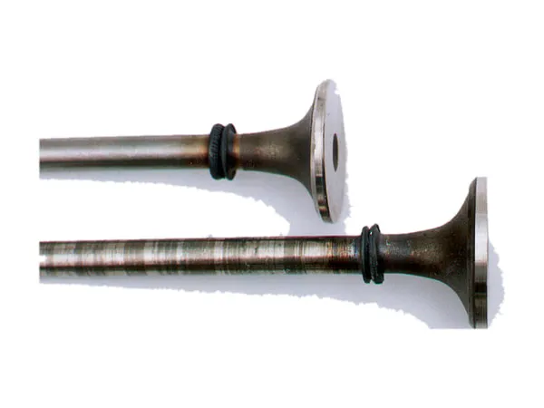 Two engine valves on a white background, with the welded joint on the stem