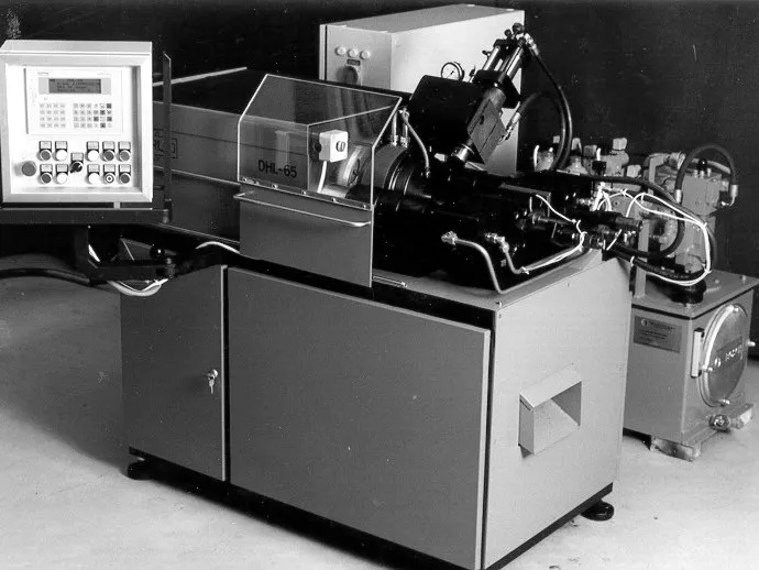 Early Harlo friction welding machine with operator panel and hydraulic power unit, archive photo
